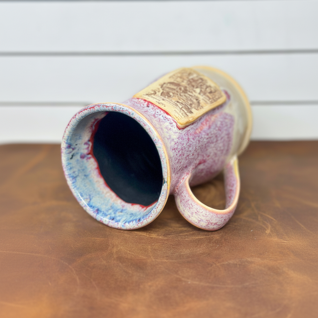 Handmade camera mug with blue glazed interior