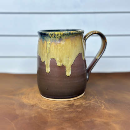 Brown stoneware mug with golden moss drip glaze